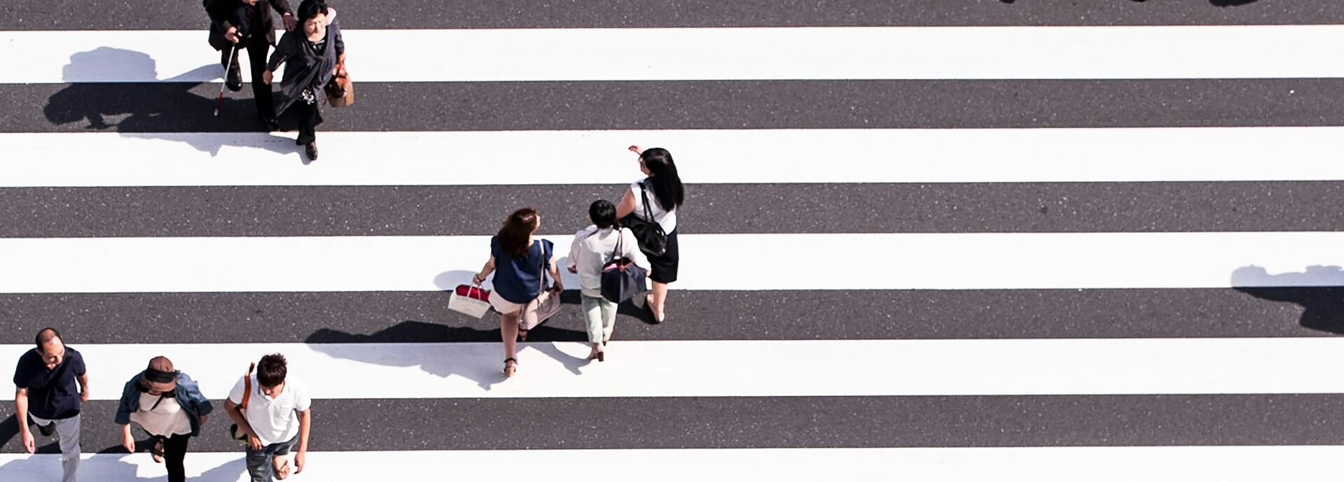 People using a road crossing