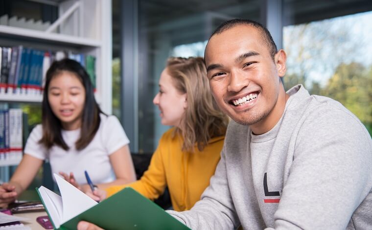 SIM students in the library 760x470